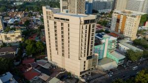 an overhead view of a tall building in a city at ABC Plus Hotel & Homes in Cebu City