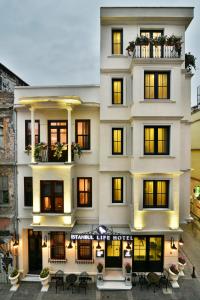 a large white building with a lot of windows at Istanbul Life Hotel in Istanbul