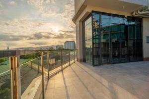 a balcony with a view of a building at ABC Plus Hotel & Homes in Cebu City