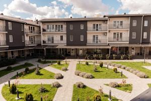 an apartment complex with a courtyard with a garden at Five Seasons apartments in Odesa