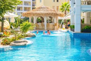 a group of people in a swimming pool at a resort at Harmony Dream Island 9 Private Apartment 618 in Sunny Beach