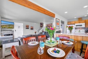 a dining room and kitchen with a table and chairs at Sunkissed 3BR Oceanview, Dog-Friendly Beach Home in Pacific Beach
