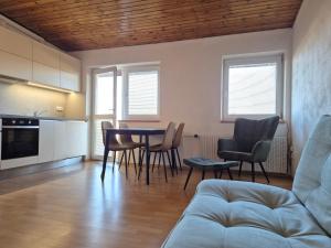 a living room with a table and chairs at BED & BREAKFAST penzion Brno in Brno