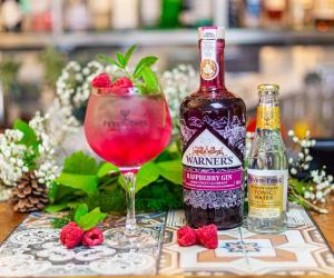 a bottle of wine and a glass of raspberry gin at Broad Leys in Aylesbury +10 photos