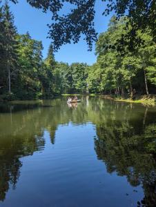 a group of people in a boat on a river at Ferienwohnung Ottmanach Schlosshof in Pischeldorf