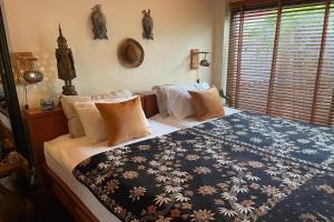 a bedroom with a bed with a blue and white blanket at Southern Lanta B9 in Ko Lanta +30 photos
