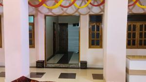 a mirror in the middle of a room at Divine Blessings Banquet and Hotel in Prayagraj