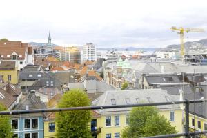 a view of a city with buildings and a crane at Scandic Neptun in Bergen
