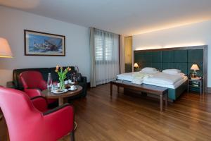 a hotel room with a bed and a table and chairs at Bad Horn - Hotel & Spa in Horn +53 photos