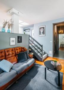 a living room with a couch and a table at Villa Pegasus in Turin +25 photos
