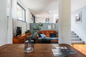 a living room with a table and a couch at Villa Pegasus in Turin