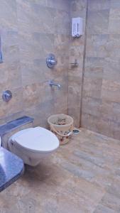 a bathroom with a toilet and a shower at Tejas 4 Bhk Villa in Pune