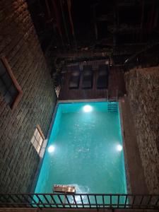 an overhead view of a swimming pool at night at Evri Hotel & Resorts in Lava