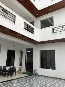 a house with a balcony and a patio at galaxy hotel jobner in Jobner
