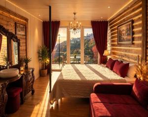 a bedroom with a bed and a large window at Villa Provance & Swimming Pool in Sighnaghi +57 photos