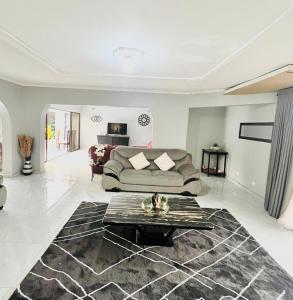 a living room with a couch and a table at The Savannah Escape in Norton