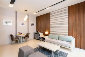a living room with a couch and a table at Cae Villa Hua Hin in Hua Hin