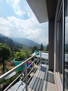 a balcony with a view of a mountain at Neoravalley Homestay, Lava in Rishop