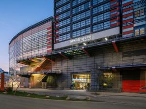 a building with a sign that reads residence inn at Residence Inn by Marriott Lille in Lille
