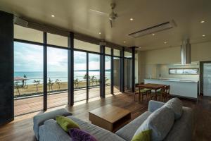 a living room with a view of the ocean at Guest Villa on the BI-CHI in Sado