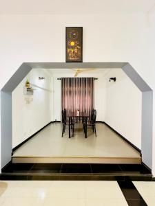 a dining room with a table and chairs in a room at Kings Garden House in Weligama +26 photos