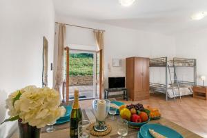 a living room with a table with fruit on it at Residence Argentiera in Miniera dellʼArgentiera
