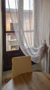 a box sitting on a table in front of a window at Nel Centro Storico in Luserna San Giovanni