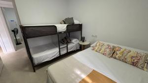 a room with two bunk beds and a bed at Finca La Arboleda in Chipiona +29 photos