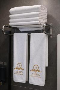 a group of towels on a rack in a bathroom at Casa Ayris Boutique Hotel in Mersin +22 photos