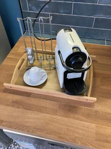 a hair dryer on a wooden cutting board with a cup at YaYaCaSa in Tangier +161 photos