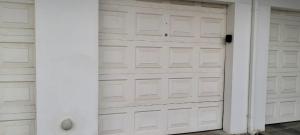a pair of garage doors in a house at On the Beach 20 in Swakopmund