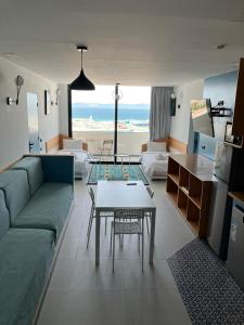 a living room with a couch and a table at YaYaCaSa in Tangier