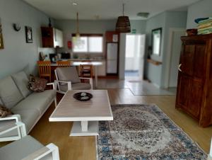 a living room with a couch and a table at On the Beach 20 in Swakopmund