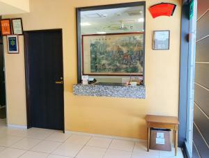 a lobby with a counter and a black door at Web Hotel Tokyo Asakusabashi in Tokyo