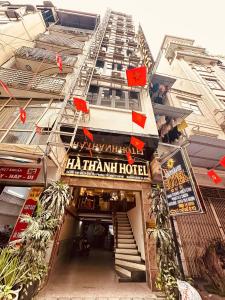 a large building with a hamiami hotel sign on it at Hà Thành Luxury Hotel in Hanoi
