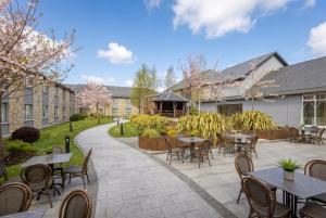 a courtyard with tables and chairs and a gazebo at Hotel Kilmore in Cavan