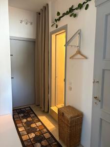 a hallway with a door and a wicker stool in a room at Villa Noza Kalamos in Kalamos +13 photos