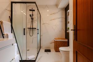 a bathroom with a shower and a toilet at Caldas Charm Getaway - Garden Terrace & Comfort in Caldas da Rainha +72 photos
