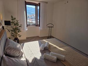 a bedroom with a bed with towels on it at Apartment Borna in Baška