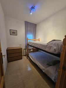 a bedroom with two bunk beds and a window at MEDDAYS Villa BERLÍN in Miami Platja +34 photos