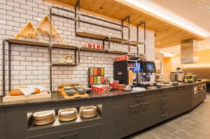a kitchen with a counter with some food on it at AvenidA Panorama Suites in Kaprun