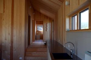 a hallway of a house with wooden walls at Østhusvik Cabin in Stavanger +7 photos