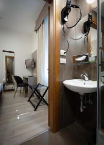 a bathroom with a sink and a mirror at Hotel Margherita in Monterosso al Mare +81 photos