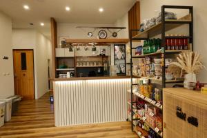 a grocery store with a white partition in a room at 宿時代民宿 24H 自助入住 入住前需完成線上報到 Hometime Self Check-in in Dayuan +24 photos