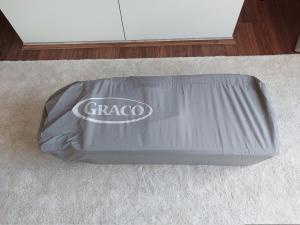 a grey dog bed sitting on a carpet at 2 beds, AC, fully enclosed patio, private parking in Poole
