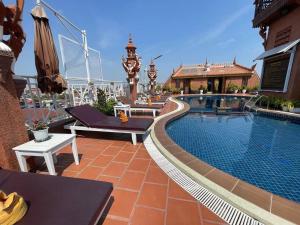 a swimming pool on top of a building at Okay 1 Villa in Siem Reap