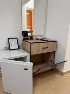 a small desk in a room with a mirror at Luxury Apartments Miranda in Ohrid