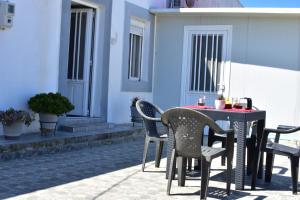 a table and chairs sitting on a patio at Despina in Kritinía +5 photos