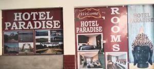 a hotel paradise sign on the side of a building at Hotel Paradise in Chandīgarh