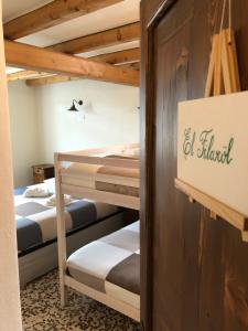a group of bunk beds in a room at LA CA' DEI COMARI - Locanda da Tullio in Capovalle